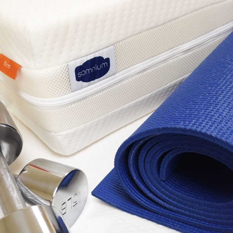 Performance. Somnium mattress with dumb bells and blue yoga mat